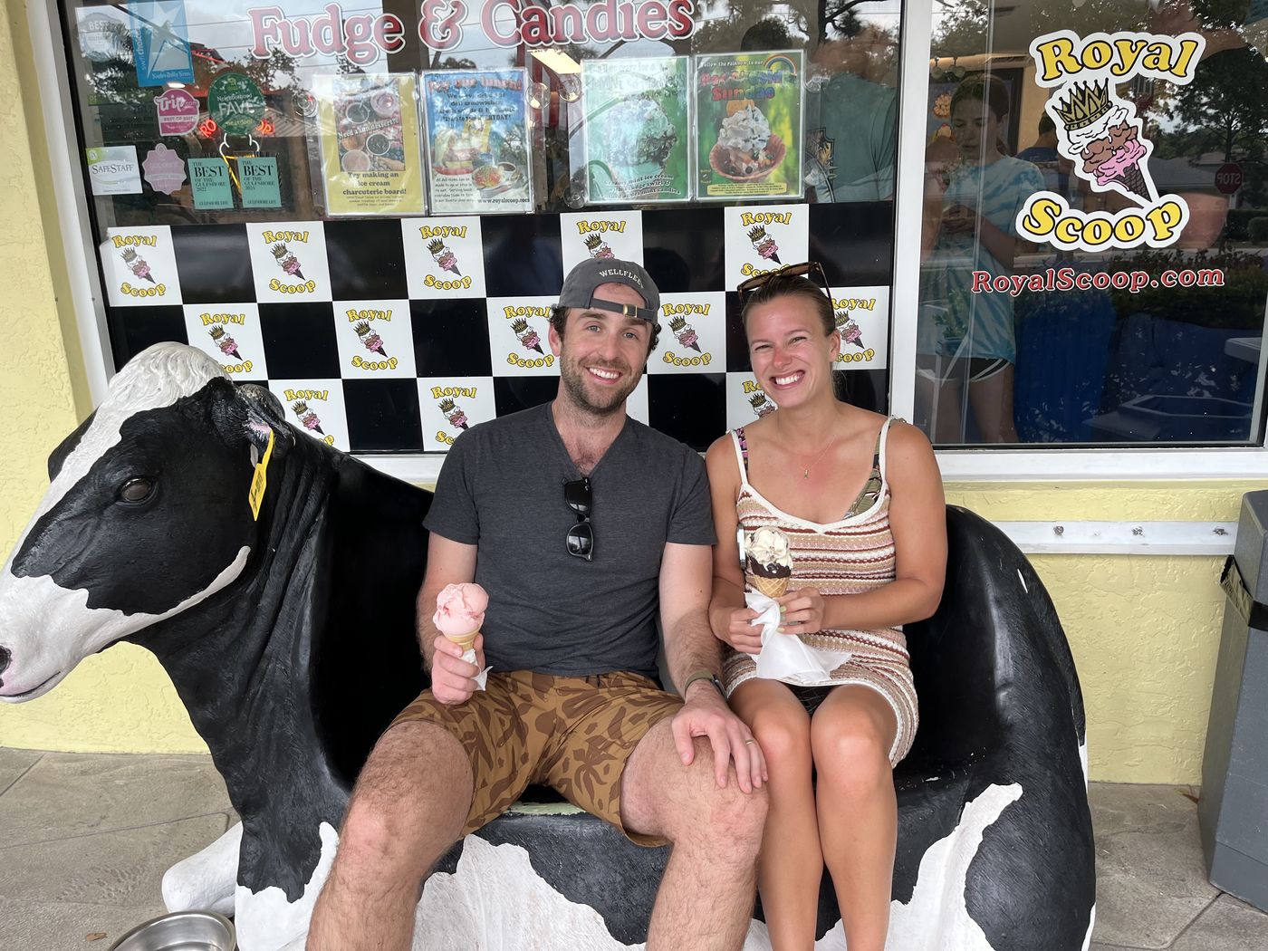 Chris and Lauren holding ice cream cones outside a scoop shop