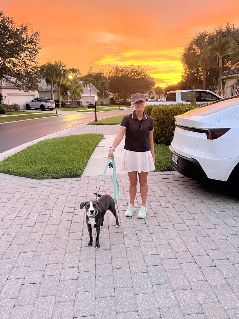 Lauren walking Ziggy at sunset in Southwest Florida